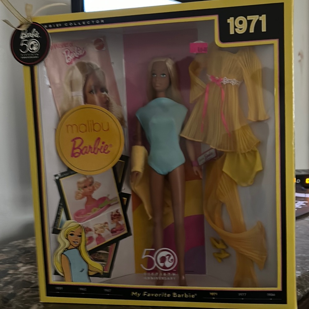 She is an original Barbie doll  she was born in1971 she has never been open come